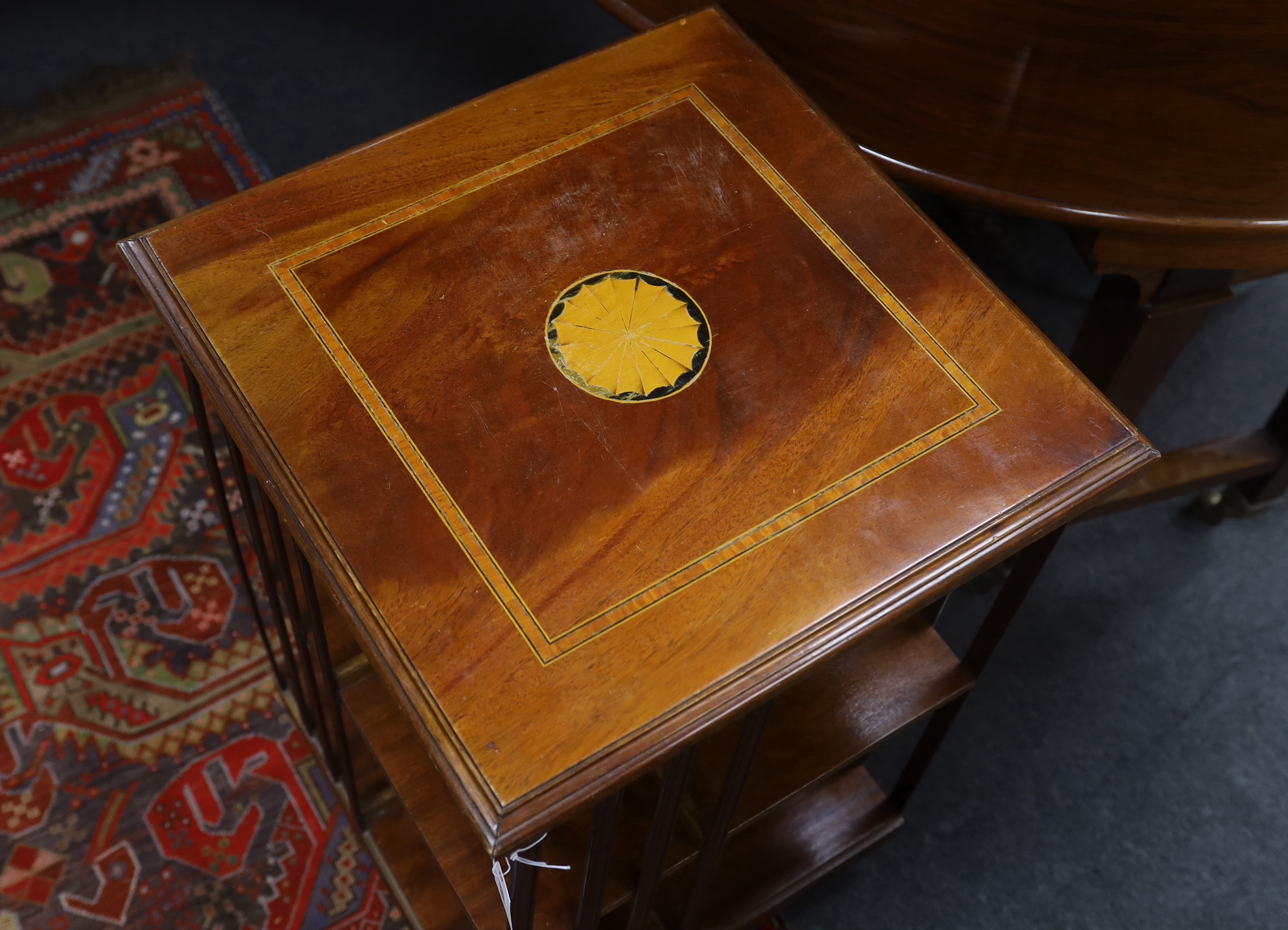 An Edwardian style satinwood inlaid mahogany revolving bookcase, width 48cm, height 77cm